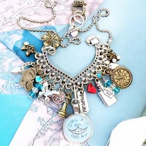 We’re all mad here necklace featuring Alice in Wonderland necklace. 21” long